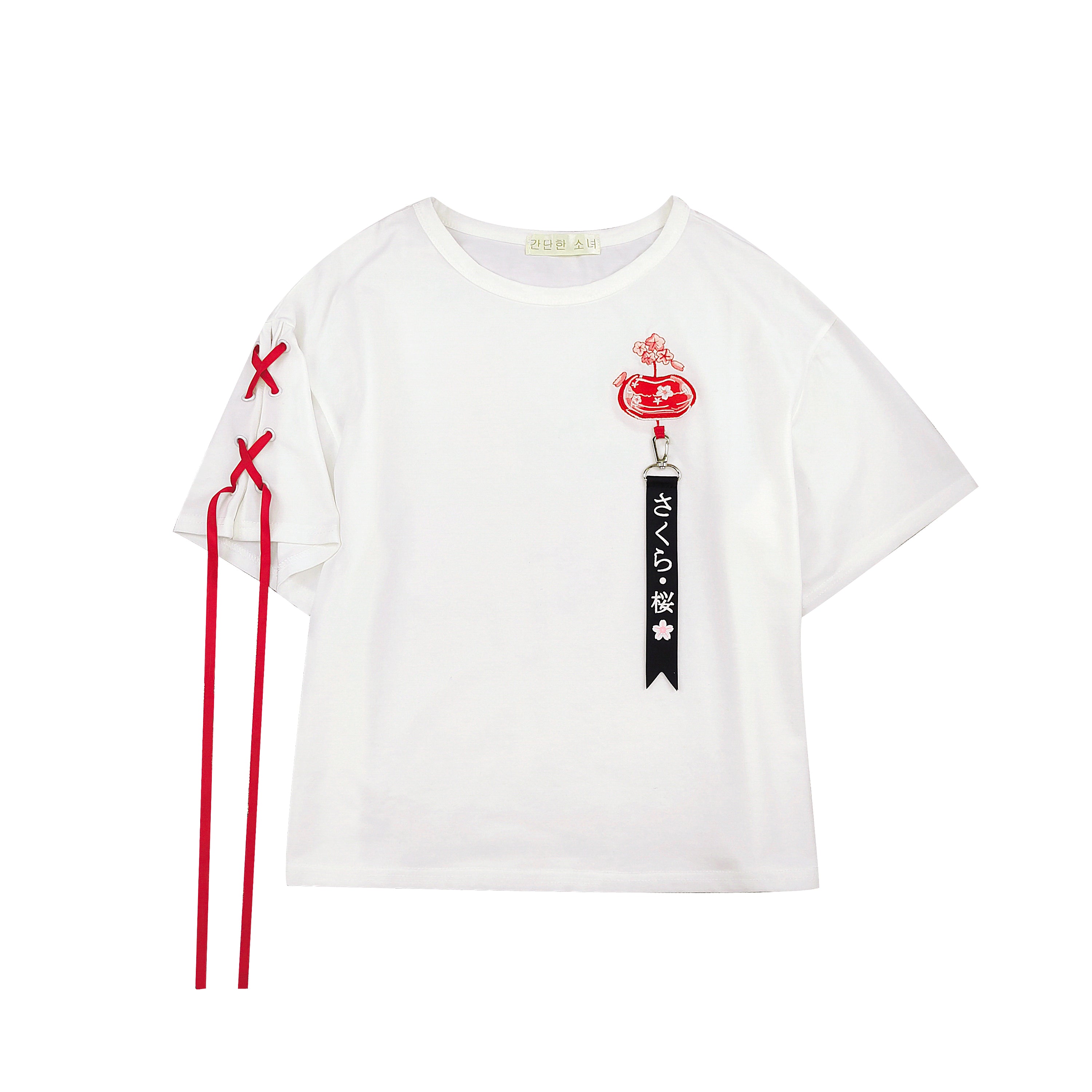White cotton T-shirt with red sakura embroidery, black ribbon tag, and crisscross red laces on sleeve.