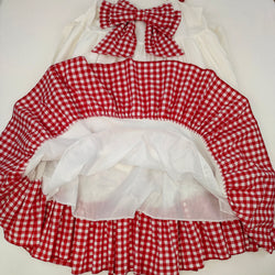 Sweet country-style dress with layered ruffles and red checkered trim.
