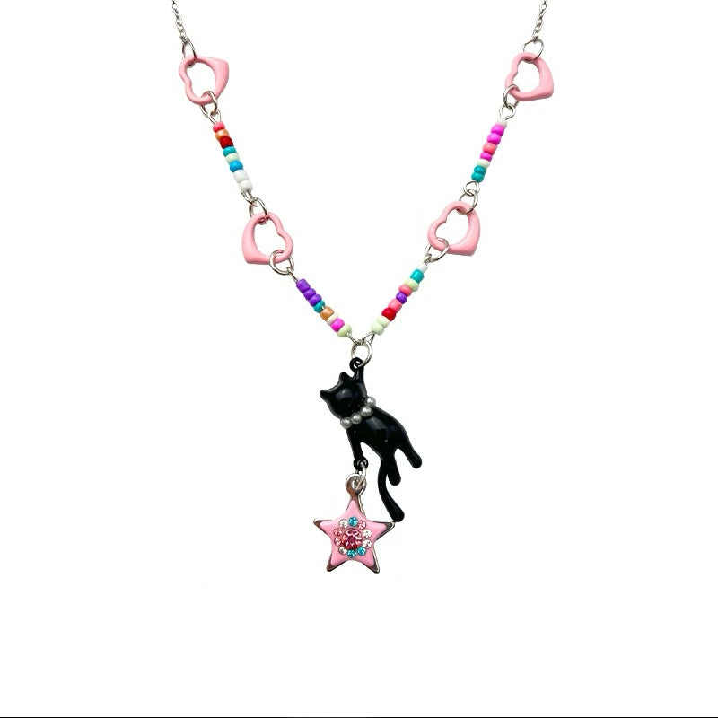 A cute black cat pendant necklace featuring pink heart links, colorful beads, and a dangling pink star charm – perfect for kawaii and Lolita fashion lovers.