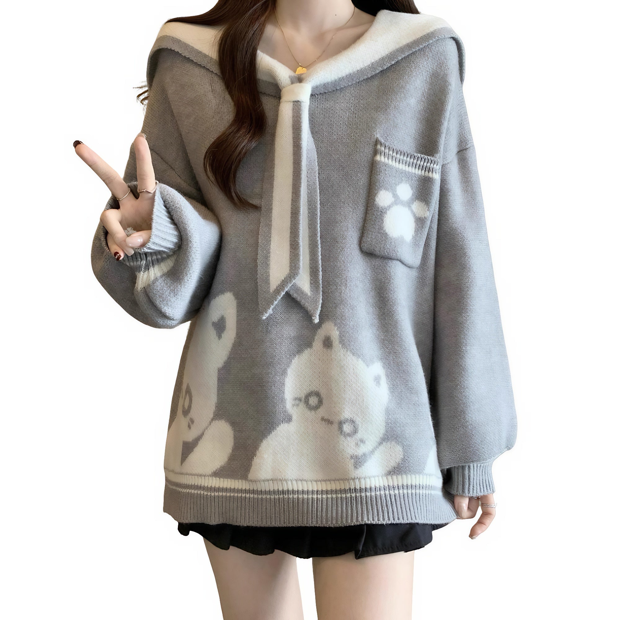 Model wearing gray sailor-style oversized pullover with cat pattern