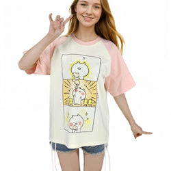 Front view of kawaii comic panel graphic T-shirt with pink raglan sleeves
