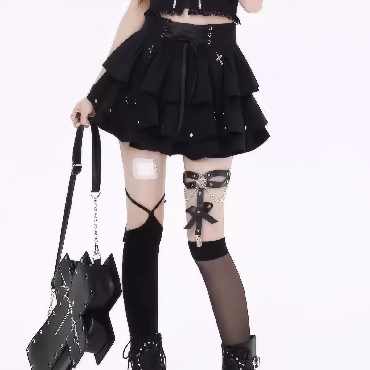 Model wearing Y2K gothic pleated mini skirt black ruffle skirt, lace-up short skirt
