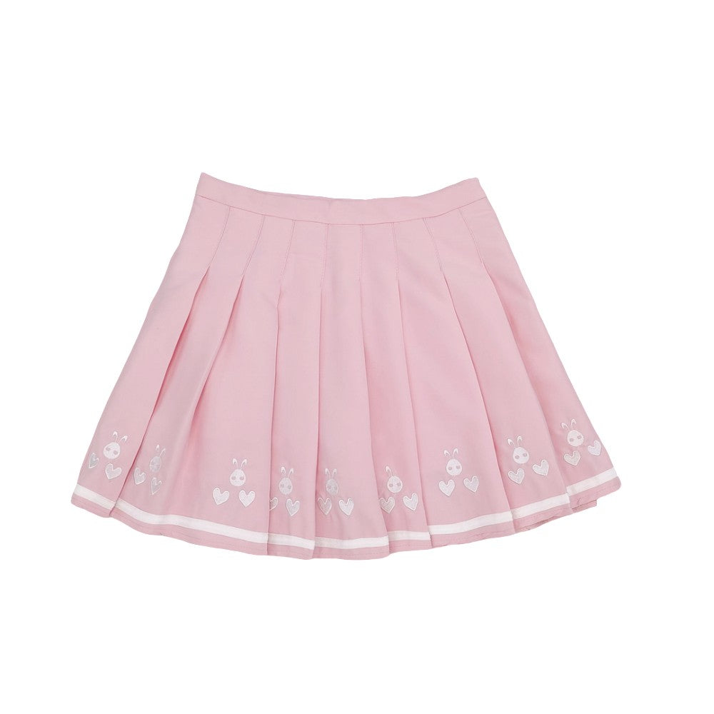 Pink pleated mini skirt with white bunny and heart embroidery on hemline
