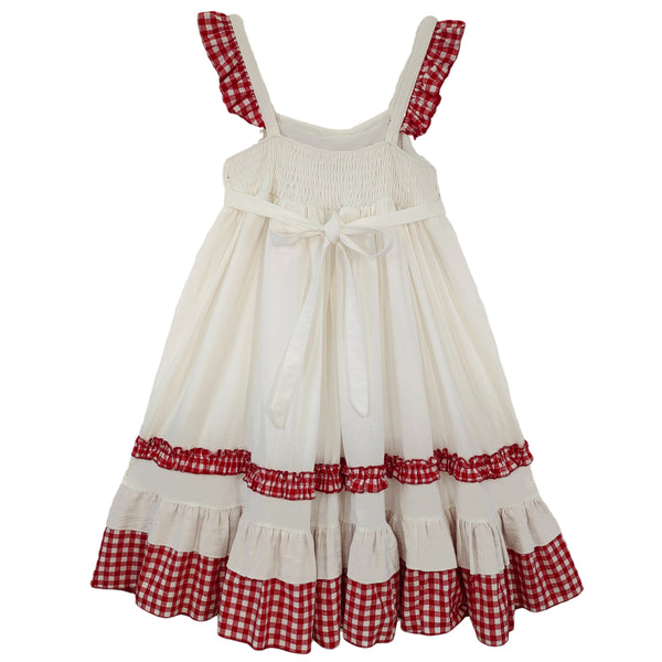 Back view of white Lolita dress with shirred waist and tied bow.