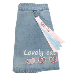 Denim mini skirt with removable suspenders, pastel pink buttons, and kawaii keychain charm.