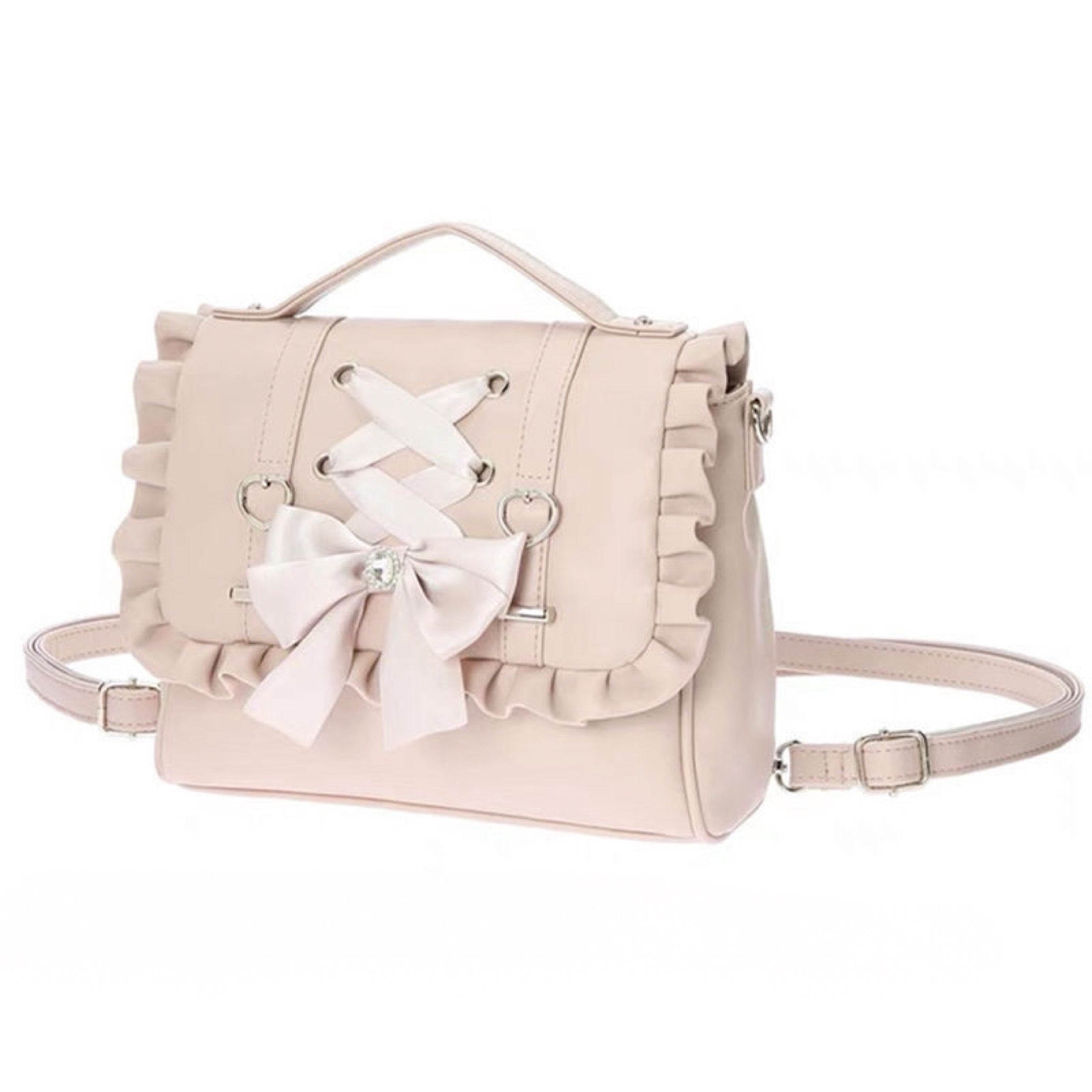 Pink pastel Lolita handbag with bow and heart rings, convertible to backpack.