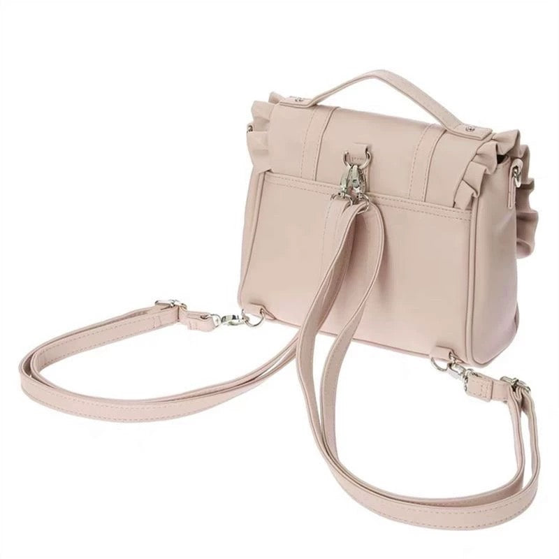 Back view of pink bag showing dual-strap backpack function and top handle.