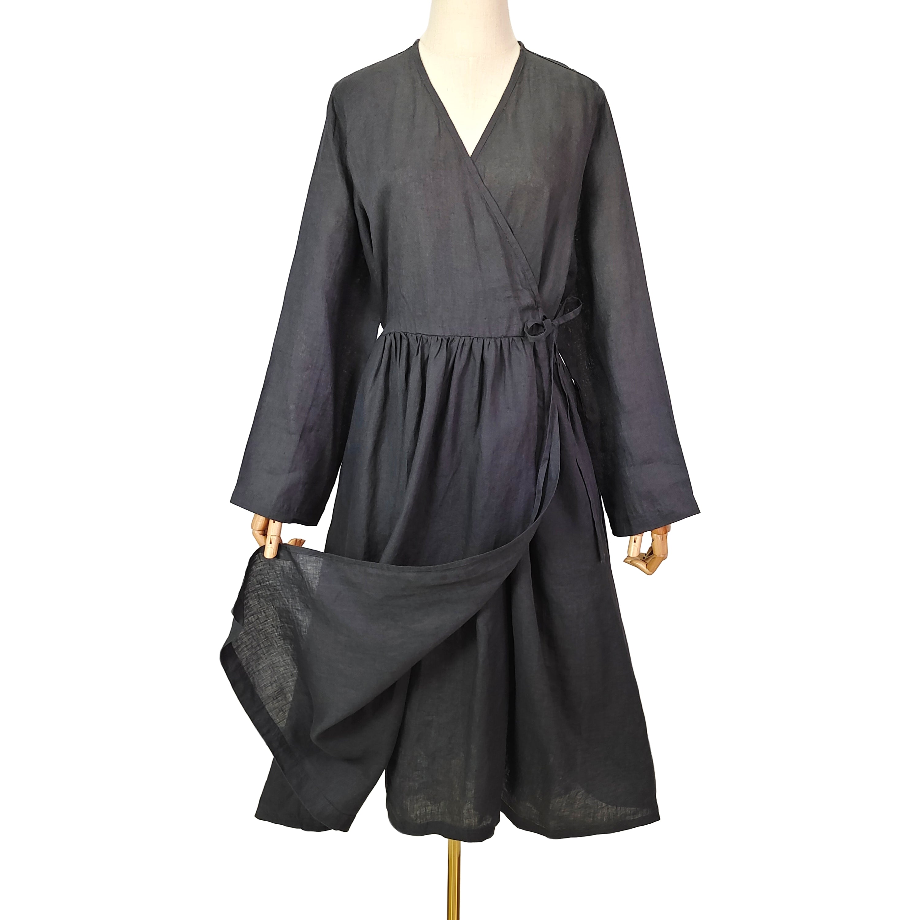 Women long sleeve wrap dress made of 100% linen, featuring adjustable waist tie, side pockets, and elegant V-neck design in forest green and dark gray colors.