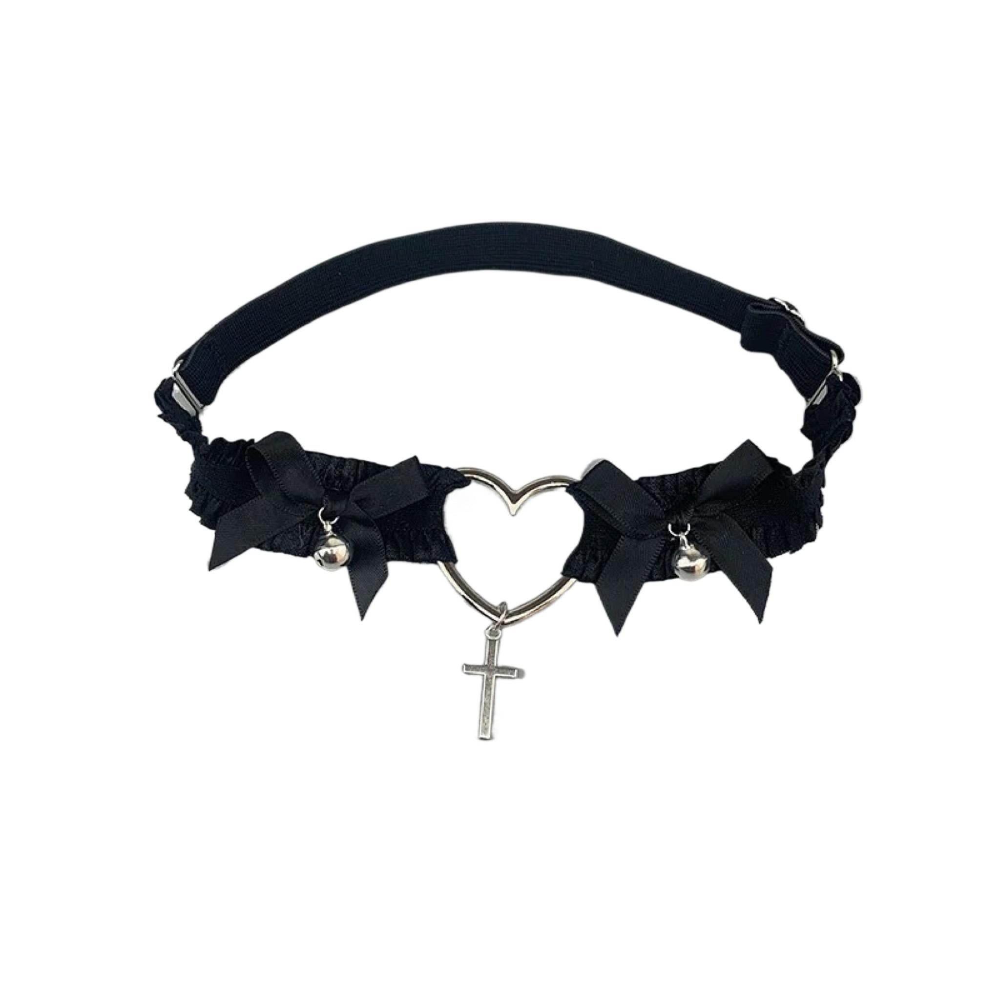Black lace Lolita thigh garter with heart charm, cross pendant, and satin bows.