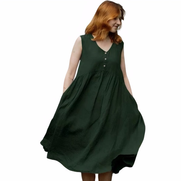 Woman wearing forest green linen summer dress with button front