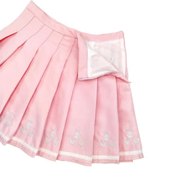 Embroidered bunny faces and hearts design on pastel pink pleated fabric