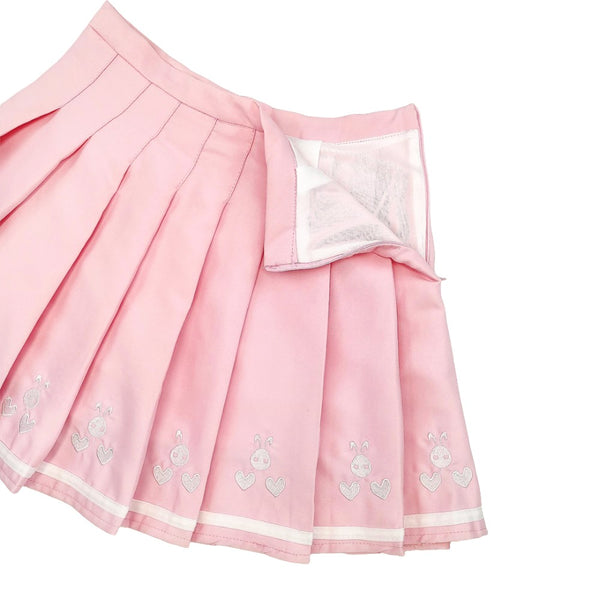 Embroidered bunny faces and hearts design on pastel pink pleated fabric