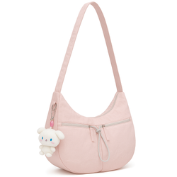 Light pink nylon shoulder bag with zippered pockets and a plush bunny keychain, styled for young women’s casual or daily use