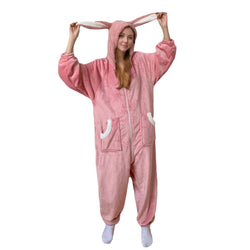 Woman wearing pink bunny ear hooded onesie with pockets and tail animal onesie pajamas