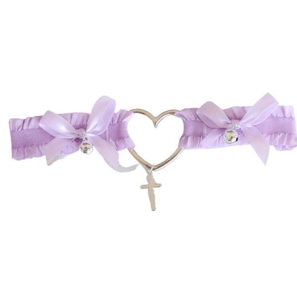 Purple Lolita thigh accessory on lace background with silver bell and bows.lolita lingerie accessory, heart shaped choker for leg