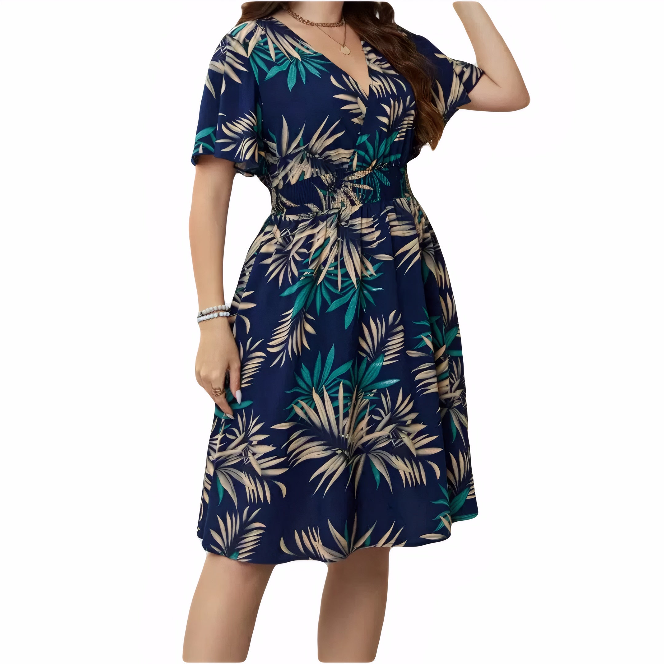 Curvy woman wearing a plus size tropical leaf V-neck smocked waist midi dress summer casual style
