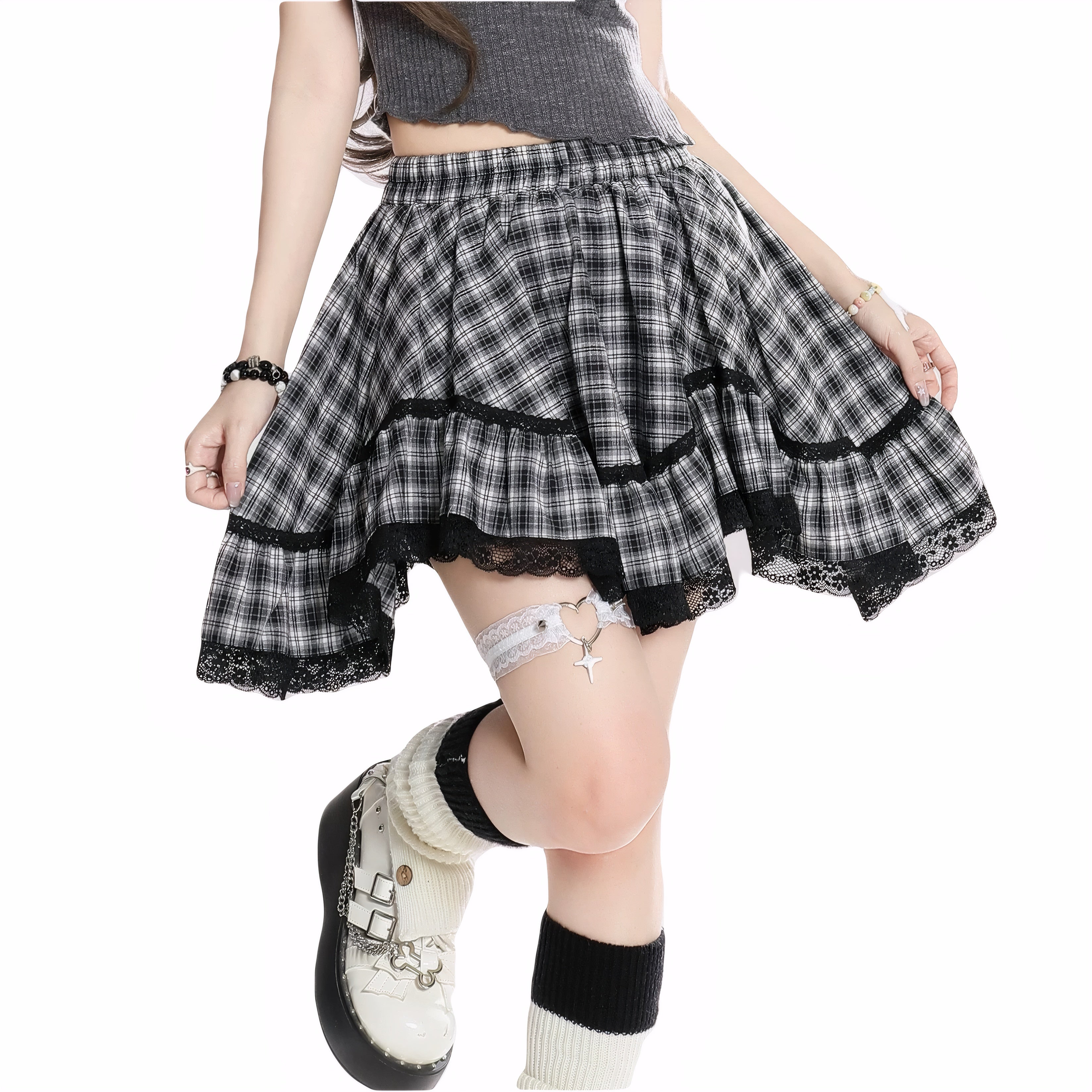 Model wearing black plaid high-waisted mini skirt with lace hem
